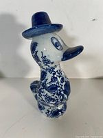 Front view of blue and white porcelain duck figurine in Gzhel style