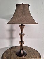 Full view of lamp on table showing overall design