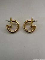 Front view of both gold tone vermeil C-hoop earrings showing shape and ball stud detail