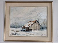 Full view of framed painting showing snowy barn, frame and signature