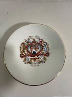 Front of white porcelain commemorative plate with portraits of Prince Charles and Lady Diana Spencer and Royal Wedding 29th July 1981 inscription