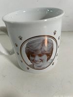 Side view showing portrait of Lady Diana Spencer on mug