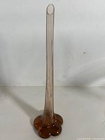 Full view of amber elephant foot bud vase front