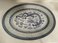 Top view of blue and white dragon porcelain oval platter