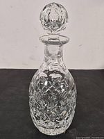 Full view of cut crystal decanter with stopper
