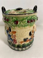 Front view showing relief decoration and lid