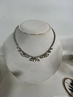Full view of rhinestone choker on display bust