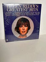 Front cover with portrait and shrink wrap