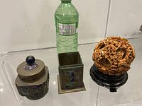 All three items beside bottle for scale
