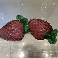 Pair of Murano glass strawberry figurines, top view showing texture and color