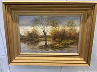Front view of framed Jerzy Jasinski oil painting