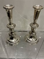Two sterling silver candlesticks full view