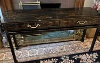 Full view of console desk front showing drawers and chinoiserie decoration
