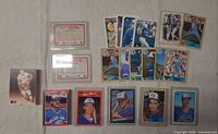 Overview of baseball and hockey cards including Blue Jays and two hockey legends