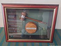 Full view of framed display with gavel and sound block