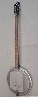 Full length view of banjo showing overall design and condition