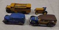 Group shot of four die-cast vehicles