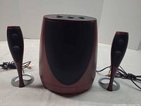 Front view of subwoofer with both satellite speakers