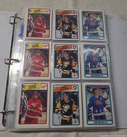 Binder page with Adam Oates, Joe Sakic, Rob Brown, Adam Graves cards