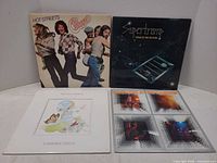 Front covers of all four LPs displayed