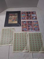 Overview showing collage, trading card sheet, and three stamp sheets