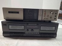 Technics RS-TR210 and Pioneer CT-5 stacked front view showing controls and cassette doors