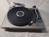 Overall view of Technics SL-23 turntable with dust cover open