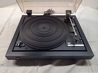 Overall view of Dual 505 turntable with dust cover and tonearm