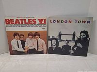 Front covers of Beatles VI and London Town LPs
