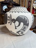 profile showing bird motif and geometric banding