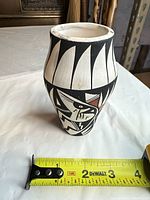 Front view of vase with measuring tape showing height about 5.75 in