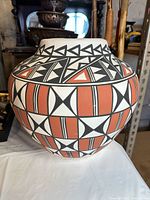 Front view of Acoma style earthenware jar showing geometric pattern