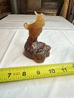 Front view showing overall form and measuring tape for scale