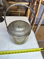 Overall view showing jar, lid, handle, scale