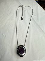 Full view of necklace showing chain, extender, and pendant