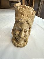 Front view of carved bearded face bowl