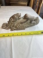 Left side view showing full length and measuring tape