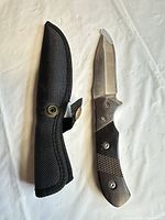 Knife and sheath side by side showing overall condition