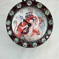 Front view showing gemset bezel and erotic dial