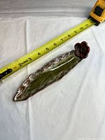 Top view with tape measure showing approx 11 in length and overall design