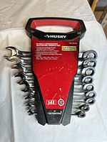 Front view of Husky 10-piece SAE ratcheting wrench set in holder