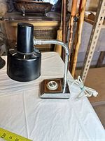 Full view of desk lamp showing shade, gooseneck, base and cord
