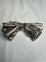 Front view of sterling silver bow brooch
