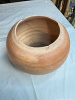 top view of spherical terracotta planter showing wide mouth and interior