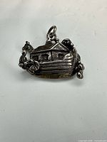 Front view of sterling silver Noah's Ark pendant with animal details