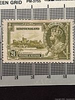 Front of 24¢ Newfoundland King George V Silver Jubilee stamp showing design details and ruler for scale
