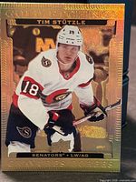 Front of 2022-23 Tim Hortons Gold Etchings #G-14 Tim Stutzle card