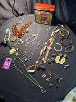 Entire jewellery lot laid out on black cloth