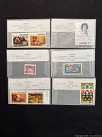 Four glassine envelopes with labelled mint Canadian stamps