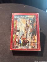 Front view of sealed New Orleans Delta Air Lines playing card deck inside red case